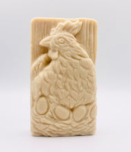 Load image into Gallery viewer, Handmade vegan soaps featuring a chicken sat on her nest of eggs, in beautiful eco friendly packaging. crafted with natural French clays, activated charcoal and essential oils. a eco-friendly, zero waste gift that’s cruelty-free, skin-nourishing, the perfect gift for easter and animal lovers. small business UK