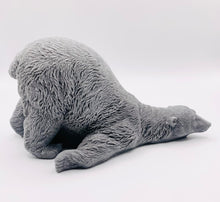 Load image into Gallery viewer, Handmade vegan soaps featuring a huge lazy polar bear with his bum up in the air. gift boxed in beautiful eco friendly packaging. crafted with natural French clays, activated charcoal and essential oils. a eco-friendly, zero waste gift that’s cruelty-free, skin-nourishing, the perfect gift for polar bear lovers, Christmas gifts or for animal lover gifts. small business UK
