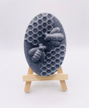 Load image into Gallery viewer, Handmade vegan soaps featuring two bees on honeycomb wrapped in beautiful eco friendly packaging crafted with natural French clays, activated charcoal and essential oils. a eco-friendly, zero waste gift that’s cruelty-free, skin-nourishing, and perfect gift for bee lovers and animal themed gifts. small business UK