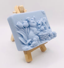 Load image into Gallery viewer, Handmade vegan soaps featuring the easter bunny with a basket full of chicks. , in beautiful eco friendly packaging. crafted with natural French clays, activated charcoal and essential oils. a eco-friendly, zero waste gift that’s cruelty-free, skin-nourishing, the perfect gift for easter and animal lovers. small business UK