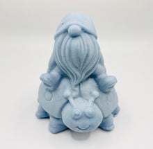 Load image into Gallery viewer, Handmade vegan soaps featuring a detailed ladybug with a gnome catching a ride on his back soap. crafted with natural French clays, activated charcoal and essential oils. a eco-friendly, zero waste gift that’s cruelty-free, skin-nourishing, and perfect for turtle lovers and gnome lover gifts. small business UK