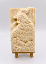 Load image into Gallery viewer, Handmade vegan soaps featuring a chicken sat on her nest of eggs, in beautiful eco friendly packaging. crafted with natural French clays, activated charcoal and essential oils. a eco-friendly, zero waste gift that’s cruelty-free, skin-nourishing, the perfect gift for easter and animal lovers. small business UK