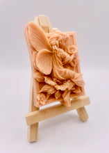 Load image into Gallery viewer, Handmade vegan soaps shaped as a beautiful elegant fairy holding a flower. crafted with natural French clays, activated charcoal and essential oils. a eco-friendly, zero waste gift that’s cruelty-free, skin-nourishing, and perfect for fairy lovers and gifting. wrapped in beautiful eco friendly packaging.