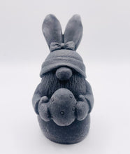 Load image into Gallery viewer, Handmade vegan soaps featuring a gorgeous gnome with easter bunny ears, holding his easter egg packaged in beautiful eco friendly packaging. crafted with natural French clays, activated charcoal and essential oils. a eco-friendly, zero waste gift thatās cruelty-free, skin-nourishing, the perfect gift for any easter hamper or gnome lover. UK Small Business