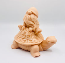 Load image into Gallery viewer, Handmade vegan soaps featuring a detailed turtle with a gnome catching a ride on his back soap. crafted with natural French clays, activated charcoal and essential oils. a eco-friendly, zero waste gift that’s cruelty-free, skin-nourishing, and perfect for turtle lovers and gnome lover gifts. small business UK