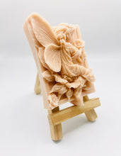 Load image into Gallery viewer, Handmade vegan soaps featuring a fairy sitting on leaves and holding a flower in beautiful eco friendly packaging. crafted with natural French clays, activated charcoal and essential oils. a eco-friendly, zero waste gift that’s cruelty-free, skin-nourishing, the perfect gift for fairy lovers or mothers day. small business UK