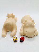 Load image into Gallery viewer, Handmade vegan soaps featuring a set of two sleeping cows . gift boxed in beautiful eco friendly packaging. crafted with natural French clays, activated charcoal and essential oils. a eco-friendly, zero waste gift that’s cruelty-free, skin-nourishing, the perfect gift for cow lovers and animal lovers. UK Small Business