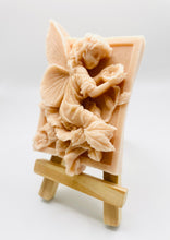 Load image into Gallery viewer, Handmade vegan soaps featuring a fairy sitting on leaves and holding a flower in beautiful eco friendly packaging. crafted with natural French clays, activated charcoal and essential oils. a eco-friendly, zero waste gift that’s cruelty-free, skin-nourishing, the perfect gift for fairy lovers or mothers day. small business UK