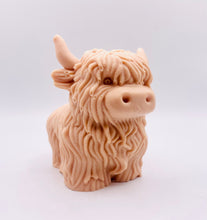 Load image into Gallery viewer, Handmade vegan soaps featuring a large detailed highland cow. crafted with natural French clays, activated charcoal and essential oils. a eco-friendly, zero waste gift that’s cruelty-free, skin-nourishing, and perfect for highland coo lovers and animal themed gifts. small business UK wrapped in beautiful eco friendly packaging.