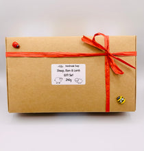 Load image into Gallery viewer, Handmade vegan soap featuring a sheep, ram and spring lamb and gift boxed in beautiful eco friendly packaging. crafted with natural French clays, activated charcoal and essential oils. a eco-friendly, zero waste gift that’s cruelty-free, skin-nourishing, and perfect for easter, sheep lovers or animal themed gifts. Small business UK