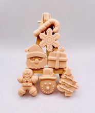 Load image into Gallery viewer, Christmas Themed Vegan Hand Soaps Gift Boxed Give the gift of clean hands! This set of six Christmas themed hand soaps make the perfect secret Santa, stocking filler and friendship gifts! Each set contains a Santa, a candy cane, snowflake, gift box, gingerbread man, snowman, and a Christmas tree. (Yes, they’re almost too cute to use… almost.) Available in your choice of French clay and essential oil: modern gifts. zero waste gifts UK. handmade gifts UK. Handmade home style UK. BrIrish made. Handmade UK.