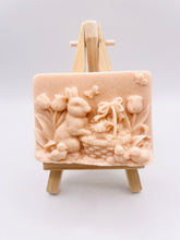 Load image into Gallery viewer, Handmade vegan soaps featuring the easter bunny with a basket full of chicks. , in beautiful eco friendly packaging. crafted with natural French clays, activated charcoal and essential oils. a eco-friendly, zero waste gift that’s cruelty-free, skin-nourishing, the perfect gift for easter and animal lovers. small business UK