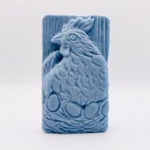 Load image into Gallery viewer, Handmade vegan soaps featuring a chicken sat on her nest of eggs, in beautiful eco friendly packaging. crafted with natural French clays, activated charcoal and essential oils. a eco-friendly, zero waste gift that’s cruelty-free, skin-nourishing, the perfect gift for easter and animal lovers. small business UK