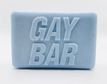 Load image into Gallery viewer, Handmade vegan soap featuring the writing GAY BAR and packaged in beautiful eco friendly packaging. crafted with natural French clays, activated charcoal and essential oils. a eco-friendly, zero waste gift that’s cruelty-free, skin-nourishing, and perfect for pride Gifts and novelty themed gifts. Small business UK