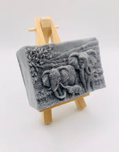 Load image into Gallery viewer, Elephant Gift | unique elephant Gift. Zro waste gift. Modern gift ideas. Etsy Uk. Handmade home style. How beautiful is this Elephant Family soap? Featuring Mum, Dad, and Baby Elephant, each bar is exquisitely detailed, capturing the gentle spirit of these majestic animals.
Our soap is vegan, cruelty-free, and made with natural French clays and luxurious essential oils, offering a rich, soothing cleanse for your skin. The earthy tones and soft scents will transport you to nature, making bath time a serene