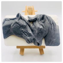 Load image into Gallery viewer, Horse gift UK, horse lover gift, pony gift. Eco conscious gift horse rider gift Beautifully detailed and full of character, this handmade soap features two horses nuzzling together - a lovely gift for any equestrian or horse lover. Made with activated charcoal to deeply cleanse and refresh the skin, this vegan and cruelty-free bar combines practicality with a touch of rustic charm. modern gifts. handmade home style. zero waste gifts. eco conscious home gifts