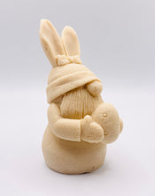 Load image into Gallery viewer, Handmade vegan soaps featuring a gorgeous gnome with easter bunny ears, holding his easter egg packaged in beautiful eco friendly packaging. crafted with natural French clays, activated charcoal and essential oils. a eco-friendly, zero waste gift thatās cruelty-free, skin-nourishing, the perfect gift for any easter hamper or gnome lover. UK Small Business
