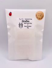 Load image into Gallery viewer, Handmade vegan soaps featuring two nuzzling giraffes in beautiful eco friendly packaging. crafted with natural French clays, activated charcoal and essential oils. a eco-friendly, zero waste gift that’s cruelty-free, skin-nourishing, the perfect gift for giraffe lovers, or for animal lover gifts. small business UK