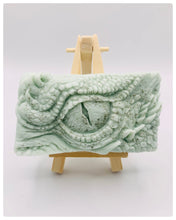 Load image into Gallery viewer, dragon Gift | dragon eye gift, dino gift, alternative gift, Dragon / Dinosaur Eye Vegan Soap Wooden display easels are available to purchase on a separate listing Calling all fantasy lovers! Step into a realm of mystical charm with our captivating dragon / dinosaur eye soap. This soap is vegan, cruelty free and available in your choice of colour and essential oil. All our soaps are made with natural clays and essential oils to gently cleanse and nourish your skin. eco conscious gift