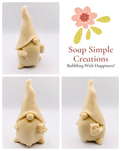 Load image into Gallery viewer, Handmade vegan soaps featuring a gorgeous gnome holding a gift in his hand packed in beautiful eco friendly packaging. crafted with natural French clays, activated charcoal and essential oils. a eco-friendly, zero waste gift that’s cruelty-free, skin-nourishing, the perfect gift for gnome lovers, Christmas gifts or for animal lover gifts. small business UK