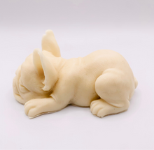 Load image into Gallery viewer, French bulldog gift UK. Handmade sleepy French bulldog vegan soap bar made with charcoal or coloured French clays and essential oils. The soap features a detailed, lifelike bulldog lying down with its head resting on its paws and a small heart shape on its rear. Zero waste gift UK