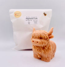 Load image into Gallery viewer, Handmade vegan soaps featuring a large detailed highland cow. crafted with natural French clays, activated charcoal and essential oils. a eco-friendly, zero waste gift that’s cruelty-free, skin-nourishing, and perfect for highland coo lovers and animal themed gifts. small business UK wrapped in beautiful eco friendly packaging.
