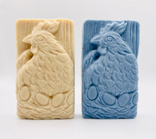 Load image into Gallery viewer, Handmade vegan soaps featuring a chicken sat on her nest of eggs, in beautiful eco friendly packaging. crafted with natural French clays, activated charcoal and essential oils. a eco-friendly, zero waste gift that’s cruelty-free, skin-nourishing, the perfect gift for easter and animal lovers. small business UK