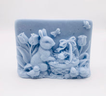Load image into Gallery viewer, Handmade vegan soaps featuring the easter bunny with a basket full of chicks. , in beautiful eco friendly packaging. crafted with natural French clays, activated charcoal and essential oils. a eco-friendly, zero waste gift that’s cruelty-free, skin-nourishing, the perfect gift for easter and animal lovers. small business UK