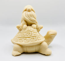 Load image into Gallery viewer, Handmade vegan soaps featuring a detailed turtle with a gnome catching a ride on his back soap. crafted with natural French clays, activated charcoal and essential oils. a eco-friendly, zero waste gift that’s cruelty-free, skin-nourishing, and perfect for turtle lovers and gnome lover gifts. small business UK