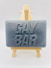 Load image into Gallery viewer, Handmade vegan soaps featuring the wording GAY BAR novelty gift. crafted with natural French clays, activated charcoal and essential oils. a eco-friendly, zero waste gift that’s cruelty-free, skin-nourishing, and perfect for pride gifts and LGBTQ gifts, hen party favours. wrapped in beautiful eco friendly packaging.