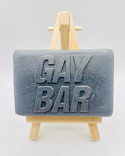 Load image into Gallery viewer, Handmade vegan soaps featuring the wording GAY BAR novelty gift. crafted with natural French clays, activated charcoal and essential oils. a eco-friendly, zero waste gift that’s cruelty-free, skin-nourishing, and perfect for pride gifts and LGBTQ gifts, hen party favours. wrapped in beautiful eco friendly packaging.