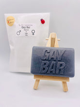 Load image into Gallery viewer, Handmade vegan soaps featuring the wording GAY BAR novelty gift. crafted with natural French clays, activated charcoal and essential oils. a eco-friendly, zero waste gift that’s cruelty-free, skin-nourishing, and perfect for pride gifts and LGBTQ gifts, hen party favours. wrapped in beautiful eco friendly packaging.