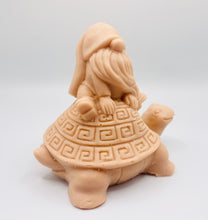 Load image into Gallery viewer, Handmade vegan soaps featuring a detailed turtle with a gnome catching a ride on his back soap. crafted with natural French clays, activated charcoal and essential oils. a eco-friendly, zero waste gift that’s cruelty-free, skin-nourishing, and perfect for turtle lovers and gnome lover gifts. small business UK