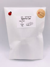Load image into Gallery viewer, Car Gift | Fathers Day Gift | Gift for Him | Sports Car Vegan Soap 
This vegan, cruelty-free soap is designed for car lovers and speed enthusiasts! . Made with your choice of French clay and essential oil, it delivers a smooth, deep clean. 
Perfect for teenagers, Father’s Day, birthdays, or just because!