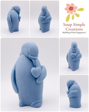 Load image into Gallery viewer, Handmade vegan soaps featuring a penguin holding a love heart packaged in beautiful eco friendly packaging crafted with natural French clays, activated charcoal and essential oils. a eco-friendly, zero waste gift that’s cruelty-free, skin-nourishing, and perfect for penguin lovers, christmas gifts and animal themed gifts. small business UK