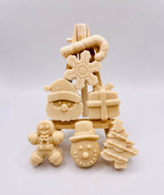 Load image into Gallery viewer, Christmas Themed Vegan Hand Soaps Gift Boxed Give the gift of clean hands! This set of six Christmas themed hand soaps make the perfect secret Santa, stocking filler and friendship gifts! Each set contains a Santa, a candy cane, snowflake, gift box, gingerbread man, snowman, and a Christmas tree. (Yes, they’re almost too cute to use… almost.) Available in your choice of French clay and essential oil: modern gifts. zero waste gifts UK. handmade gifts UK. Handmade home style UK. BrIrish made. Handmade UK.