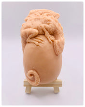 Load image into Gallery viewer, Dinosaur Gift | dragon Gift | Dragon & Egg Vegan Soap Check out this majestic dragon guarding a mysterious, enchanting egg – all captured in a luxurious bar of soap! Vegan, cruelty-free, and elegantly wrapped in eco-friendly packaging. All our soaps are made with natural clays and essential oils to gently cleanse and nourish your skin. Plus, they come in eco-friendly packaging so you can feel good about your purchase and the environment