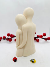 Load image into Gallery viewer, Handmade vegan soaps featuring a man embracing a woman, in beautiful eco friendly packaging. crafted with natural French clays, activated charcoal and essential oils. a eco-friendly, zero waste gift that’s cruelty-free, skin-nourishing, the perfect gift for valentines day or for anniversaries. small business UK