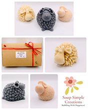 Load image into Gallery viewer, Handmade vegan soap featuring a sheep, ram and spring lamb and gift boxed in beautiful eco friendly packaging. crafted with natural French clays, activated charcoal and essential oils. a eco-friendly, zero waste gift that’s cruelty-free, skin-nourishing, and perfect for easter, sheep lovers or animal themed gifts. Small business UK