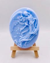 Load image into Gallery viewer, Handmade vegan Guardian Angel soap bar, features a detailed angel with flowing wings. Natural, cruelty-free UK soap ideal for spiritual gifts, zero waste skincare, and sustainable bathroom décor. British-made artisan soap perfect for eco-conscious shoppers. Wrapped in beautiful eco friendly packaging . Small business UK