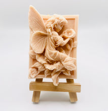 Load image into Gallery viewer, Handmade vegan soaps featuring a fairy sitting on leaves and holding a flower in beautiful eco friendly packaging. crafted with natural French clays, activated charcoal and essential oils. a eco-friendly, zero waste gift that’s cruelty-free, skin-nourishing, the perfect gift for fairy lovers or mothers day. small business UK