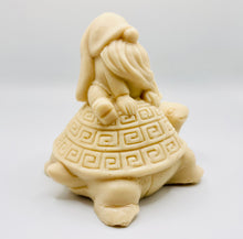 Load image into Gallery viewer, Handmade vegan soaps featuring a detailed turtle with a gnome catching a ride on his back soap. crafted with natural French clays, activated charcoal and essential oils. a eco-friendly, zero waste gift that’s cruelty-free, skin-nourishing, and perfect for turtle lovers and gnome lover gifts. small business UK