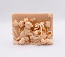 Load image into Gallery viewer, Handmade vegan soaps featuring the easter bunny with a basket full of chicks. , in beautiful eco friendly packaging. crafted with natural French clays, activated charcoal and essential oils. a eco-friendly, zero waste gift that’s cruelty-free, skin-nourishing, the perfect gift for easter and animal lovers. small business UK