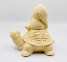 Load image into Gallery viewer, Handmade vegan soaps featuring a detailed turtle with a gnome catching a ride on his back soap. crafted with natural French clays, activated charcoal and essential oils. a eco-friendly, zero waste gift that’s cruelty-free, skin-nourishing, and perfect for turtle lovers and gnome lover gifts. small business UK
