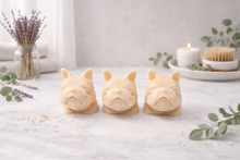 Load image into Gallery viewer, Three French bulldog-shaped soaps on a white surface with decorative elements.
