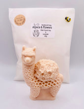 Load image into Gallery viewer, Handmade vegan soaps featuring a llama or alpaca carrying a bouquet of flowers on its back wrapped in beautiful eco friendly packaging crafted with natural French clays, activated charcoal and essential oils. a eco-friendly, zero waste gift that’s cruelty-free, skin-nourishing, and perfect for alpaca or llama gifts and animal themed gifts. small business UK