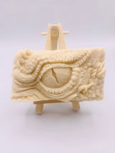 Load image into Gallery viewer, dragon Gift | dragon eye gift, dino gift, alternative gift, Dragon / Dinosaur Eye Vegan Soap Wooden display easels are available to purchase on a separate listing Calling all fantasy lovers! Step into a realm of mystical charm with our captivating dragon / dinosaur eye soap. This soap is vegan, cruelty free and available in your choice of colour and essential oil. All our soaps are made with natural clays and essential oils to gently cleanse and nourish your skin. eco conscious gift