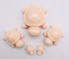 Load image into Gallery viewer, Handmade vegan soaps featuring a set of 5 turtle family soaps and gift boxed in beautiful eco friendly packaging crafted with natural French clays, activated charcoal and essential oils. a eco-friendly, zero waste gift that’s cruelty-free, skin-nourishing, and perfect for turtle lovers and animal themed gifts. small business UK