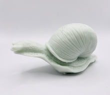Load image into Gallery viewer, Handmade vegan soaps featuring a detailed snail, in beautiful eco friendly packaging. crafted with natural French clays, activated charcoal and essential oils. a eco-friendly, zero waste gift that’s cruelty-free, skin-nourishing, the perfect gift for snail lovers, gardeners or for animal lovers. small business UK
