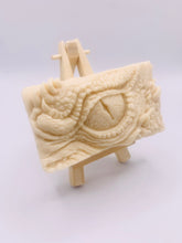 Load image into Gallery viewer, dragon Gift | dragon eye gift, dino gift, alternative gift, Dragon / Dinosaur Eye Vegan Soap Wooden display easels are available to purchase on a separate listing Calling all fantasy lovers! Step into a realm of mystical charm with our captivating dragon / dinosaur eye soap. This soap is vegan, cruelty free and available in your choice of colour and essential oil. All our soaps are made with natural clays and essential oils to gently cleanse and nourish your skin. eco conscious gift